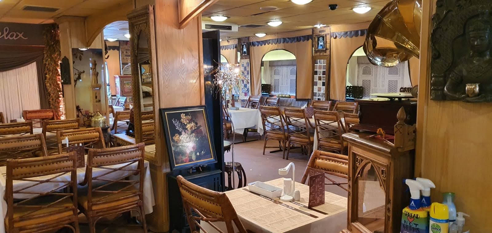 Dining room with arched doorways and gramophone