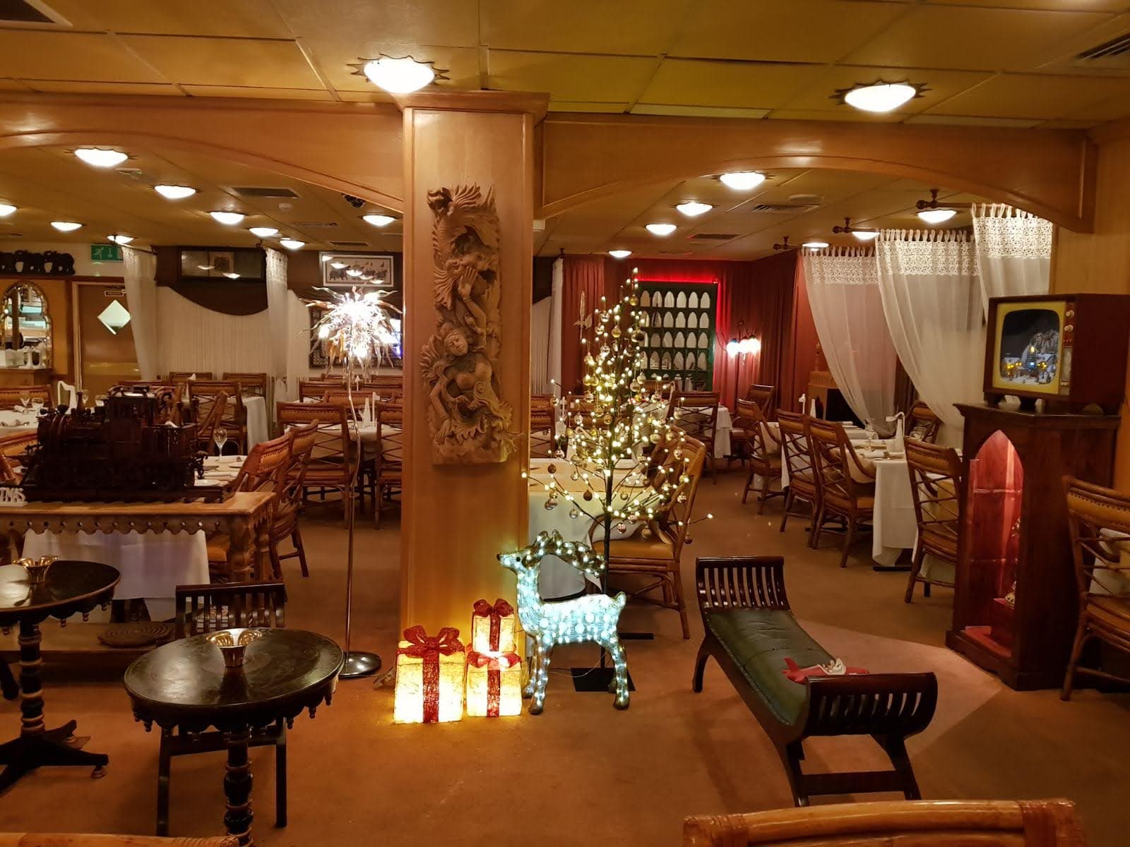 Dining room with carved pillar and fairy lights