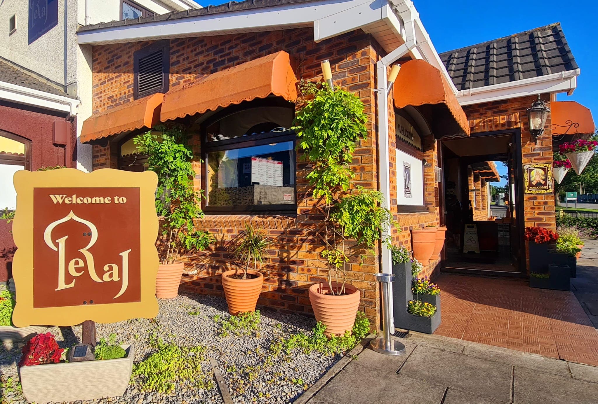 Leraj entrance close-up with hanging plants